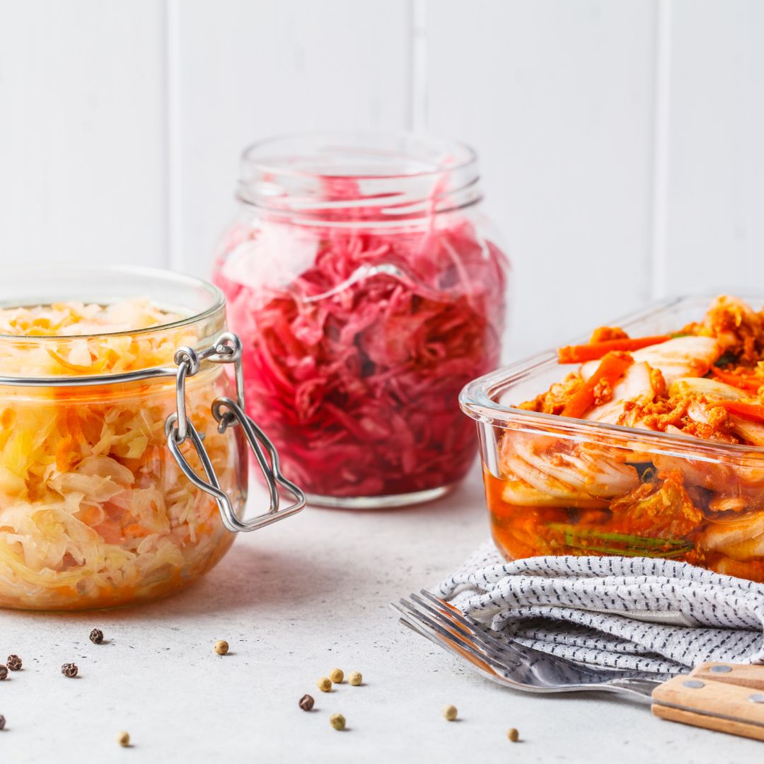 Close-up of fermented vegetables like sauerkraut and kimchi for gut microbiome support.